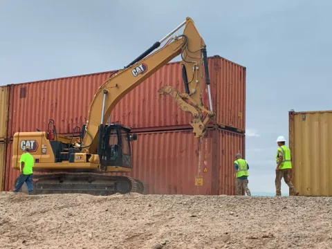 WH, Ducey Spar Over Shipping Containers Filling Border Wall Gaps