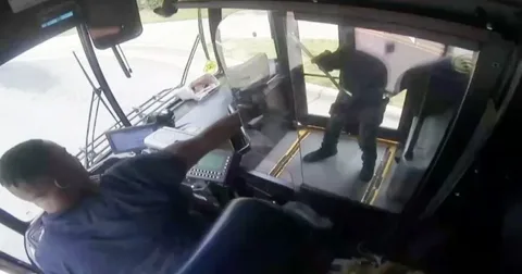 Security video captures terrifying shootout between bus driver and passenger who was allegedly angry over missed stop